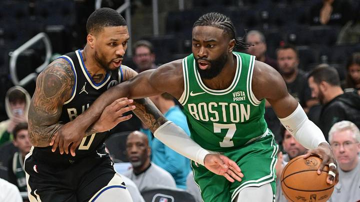 Apr 9, 2024; Milwaukee, Wisconsin, USA; Boston Celtics forward Jaylen Brown (7) drives past Milwaukee Bucks guard Damian Lillard (0) in the third quarter at Fiserv Forum. Mandatory Credit: Benny Sieu-Imagn Images Apr 9, 2024; Milwaukee, Wisconsin, USA; Boston Celtics forward Jaylen Brown (7) drives past Milwaukee Bucks guard Damian Lillard (0) in the third quarter at Fiserv Forum. Mandatory Credit: Benny Sieu-Imagn Images