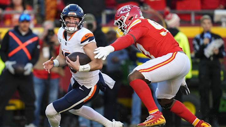 Nov 10, 2024; Kansas City, Missouri, USA; Denver Broncos quarterback Bo Nix (10) is sacked by Kansas City Chiefs defensive end Felix Anudike-Uzomah (97) at GEHA Field at Arrowhead Stadium. Mandatory Credit: Jay Biggerstaff-Imagn Images