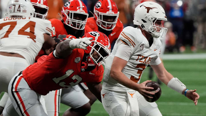 Georgia defensive lineman Mykel Williams (13) goes in for a sack on Texas quarterback Quinn Ewers (3) during the second half of the SEC championship game against Texas in Atlanta, on Saturday, Dec. 7, 2024. Georgia defensive lineman Mykel Williams (13) goes in for a sack on Texas quarterback Quinn Ewers (3) during the second half of the SEC championship game against Texas in Atlanta, on Saturday, Dec. 7, 2024.