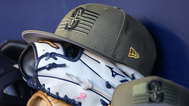 A Seattle Mariners Armed Forces Day hat is pictured in the dugout before a game against the Atlanta Braves on May 20, 2023, at Truist Park.