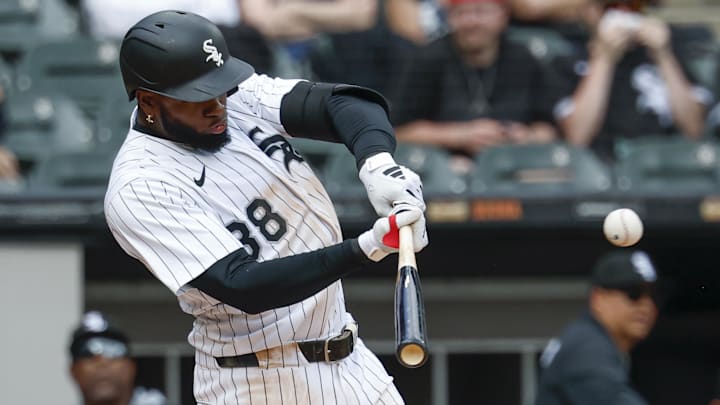 Chicago White Sox center fielder Luis Robert Jr. (88) hits a three-run double against the Milwaukee Brewers at Rate Field. 