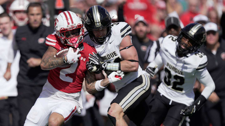 Wisconsin wide receiver Trech Kekahuna (2) picks up 29 yards on a run before being shoved out of bounds by Purdue defensive back Dillon Thieneman (31) during the second quarter of their game Saturday, October 5, 2024, at Camp Randall Stadium in Madison. Wisconsin. Wisconsin wide receiver Trech Kekahuna (2) picks up 29 yards on a run before being shoved out of bounds by Purdue defensive back Dillon Thieneman (31) during the second quarter of their game Saturday, October 5, 2024, at Camp Randall Stadium in Madison. Wisconsin.
