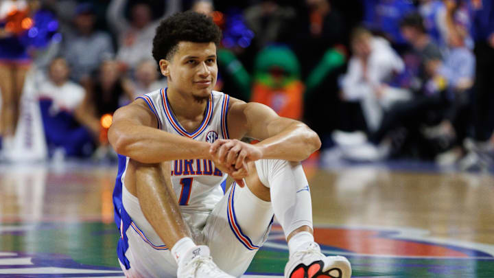 Dec 4, 2024; Gainesville, Florida, USA; Florida Gators guard Walter Clayton Jr. (1) smiles while sitting on the floor after making a three point basket against the Virginia Cavaliers during the second half at Exactech Arena at the Stephen C. O'Connell Center. Mandatory Credit: Matt Pendleton-Imagn Images Dec 4, 2024; Gainesville, Florida, USA; Florida Gators guard Walter Clayton Jr. (1) smiles while sitting on the floor after making a three point basket against the Virginia Cavaliers during the second half at Exactech Arena at the Stephen C. O'Connell Center. Mandatory Credit: Matt Pendleton-Imagn Images