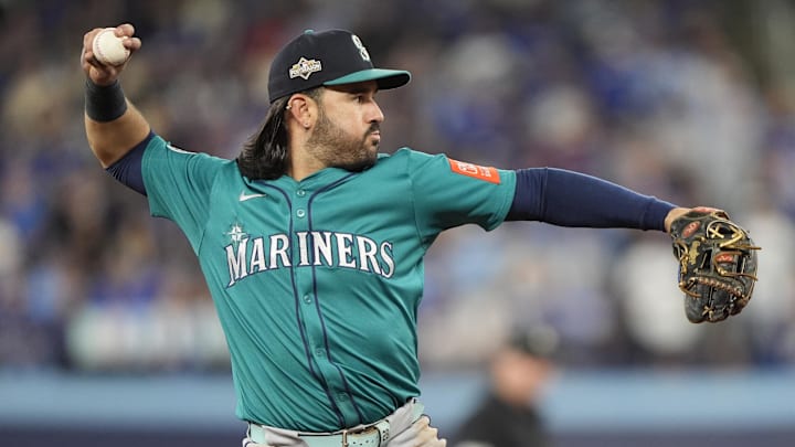 Oct 19, 2025; Toronto, Ontario, CAN; Seattle Mariners third baseman Eugenio Suarez (28) throws to first for an out against Toronto Blue Jays right fielder George Springer (not pictured) in the sixth inning during game six of the ALCS round for the 2025 MLB playoffs at Rogers Centre. Mandatory Credit: John E. Sokolowski-Imagn Images