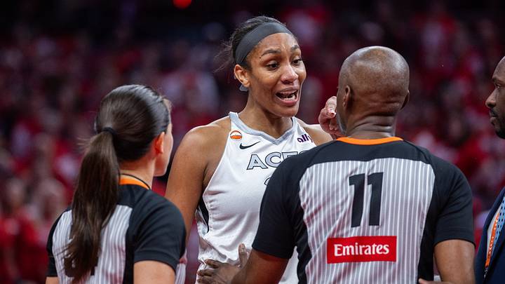 Sep 29, 2026; Indianapolis, Indiana, USA; Las Vegas Aces center A'ja Wilson (22) talks to a referee after she went into the stands to confront a fan during game two of the first round for the 2026 WNBA Playoffs against the Indiana Fever at Gainbridge Fieldhouse. Mandatory Credit: Trevor Ruszkowski-Imagn Images Sep 29, 2026; Indianapolis, Indiana, USA; Las Vegas Aces center A'ja Wilson (22) talks to a referee after she went into the stands to confront a fan during game two of the first round for the 2026 WNBA Playoffs against the Indiana Fever at Gainbridge Fieldhouse. Mandatory Credit: Trevor Ruszkowski-Imagn Images
