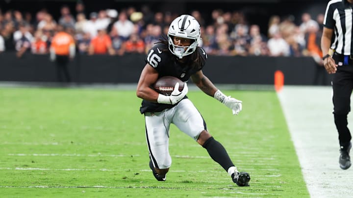 Sep 28, 2025; Paradise, Nevada, USA; Las Vegas Raiders wide receiver Jakobi Meyers (16) runs the ball during the second half against the Chicago Bears at Allegiant Stadium. Mandatory Credit: Kiyoshi Mio-Imagn Images