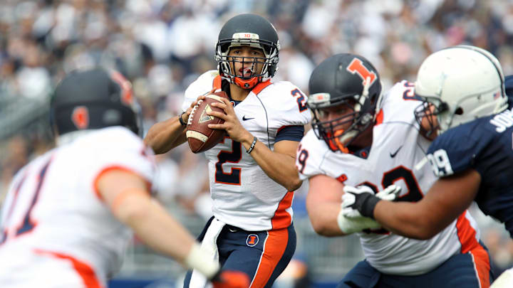 Nov 2, 2013; University Park, PA, USA; Illinois Fighting Illini quarterback Nathan Scheelhaase (2) drops back for a pass during the second quarter against the Penn State Nittany Lions at Beaver Stadium. Penn State defeated Illinois 24-17. Mandatory Credit: Matthew O'Haren-Imagn Images Nov 2, 2013; University Park, PA, USA; Illinois Fighting Illini quarterback Nathan Scheelhaase (2) drops back for a pass during the second quarter against the Penn State Nittany Lions at Beaver Stadium. Penn State defeated Illinois 24-17. Mandatory Credit: Matthew O'Haren-Imagn Images