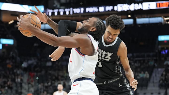 San Antonio Spurs center Victor Wembanyama (1) fouls LA Clippers forward Kawhi Leonard (2) in the first half at Frost Bank Center. Mandatory Credit: Daniel Dunn-Imagn Images San Antonio Spurs center Victor Wembanyama (1) fouls LA Clippers forward Kawhi Leonard (2) in the first half at Frost Bank Center. Mandatory Credit: Daniel Dunn-Imagn Images