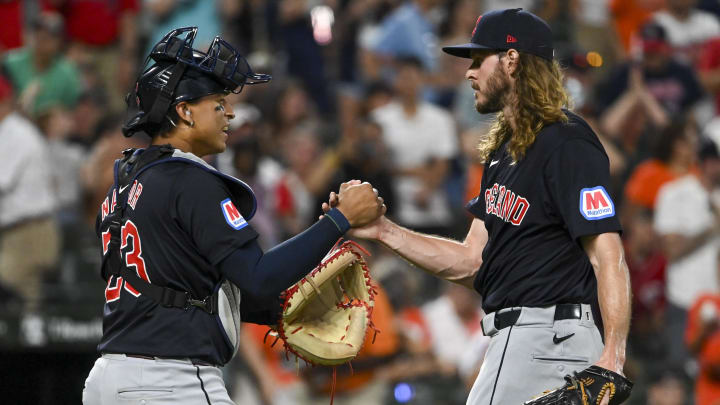 Jun 24, 2024; Baltimore, Maryland, USA;  Cleveland Guardians catcher Bo Naylor (23) celebrates with pitcher Scott Barlow (58) after the game against the Baltimore Orioles at Oriole Park at Camden Yards.
