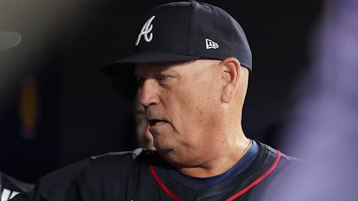 Atlanta Braves manager Brian Snitker stands in the dugout after the sixth inning against the Toronto Blue Jays at Rogers Centre.