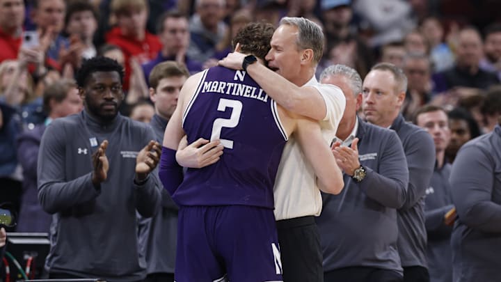 Mar 12, 2026; Chicago, IL, USA; Northwestern Wildcats head coach Chris Collins hugs forward Nick Martinelli (2) as he leaves the game against Purdue Boilermakers during the second half at United Center. Mandatory Credit: Kamil Krzaczynski-Imagn Images