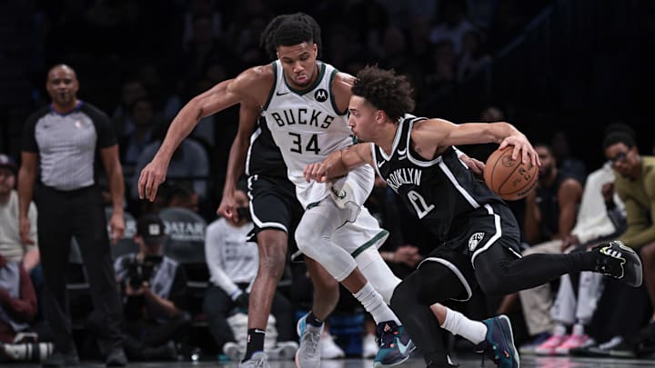 Dec 27, 2023; Brooklyn, New York, USA; Brooklyn Nets forward Jalen Wilson (22) dribbles against Milwaukee Bucks forward Giannis Antetokounmpo (34) during the second half at Barclays Center. Mandatory Credit: Vincent Carchietta-Imagn Images