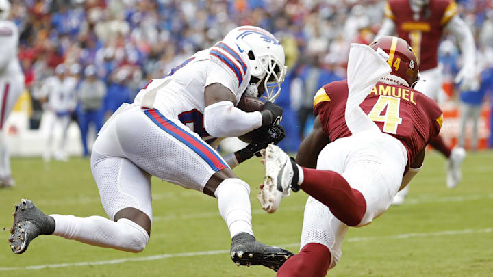 Sep 24, 2023; Landover, Maryland, USA; Buffalo Bills cornerback Tre'Davious White (27) intercepts a pass intended for Washington Commanders wide receiver Curtis Samuel (4) in the end zone during the third quarter at FedExField.