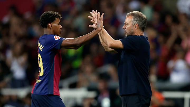 Hansi Flick (right) welcomed Lamine Yamal back into the starting XI on Tuesday