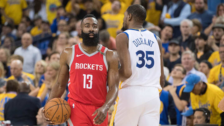 May 26, 2018; Oakland, CA, USA; Houston Rockets guard James Harden (13) and Golden State Warriors forward Kevin Durant (35) during the second quarter in game six of the Western conference finals of the 2018 NBA Playoffs at Oracle Arena. The Warriors defeated the Rockets 115-86 for a 3-3 tie in the series. Mandatory Credit: Kyle Terada-Imagn Images May 26, 2018; Oakland, CA, USA; Houston Rockets guard James Harden (13) and Golden State Warriors forward Kevin Durant (35) during the second quarter in game six of the Western conference finals of the 2018 NBA Playoffs at Oracle Arena. The Warriors defeated the Rockets 115-86 for a 3-3 tie in the series. Mandatory Credit: Kyle Terada-Imagn Images