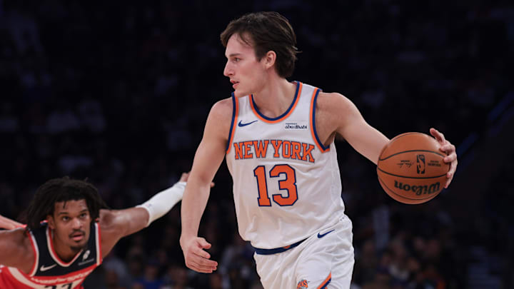 Oct 13, 2025; New York, New York, USA; New York Knicks guard Tyler Kolek (13) dribbles in front of Washington Wizards forward Dillon Jones (33) during the first half at Madison Square Garden. Mandatory Credit: Vincent Carchietta-Imagn Images