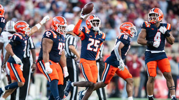 Dec 31, 2024; Orlando, FL, USA; Illinois Fighting Illini defensive back Jaheim Clarke (25) celebrates his fumble recovery against the South Carolina Gamecocks in the third quarter at Camping World Stadium. Mandatory Credit: Jeremy Reper-Imagn Images Dec 31, 2024; Orlando, FL, USA; Illinois Fighting Illini defensive back Jaheim Clarke (25) celebrates his fumble recovery against the South Carolina Gamecocks in the third quarter at Camping World Stadium. Mandatory Credit: Jeremy Reper-Imagn Images