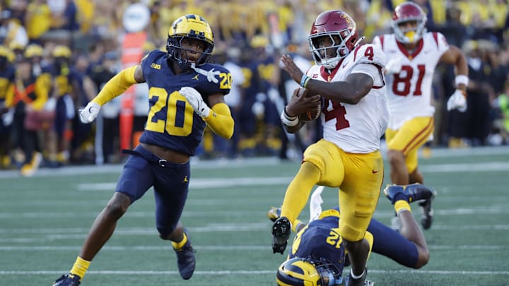 USC Trojans running back Woody Marks (4) runs while defended by Michigan Wolverines defensive back Jyaire Hill (20)