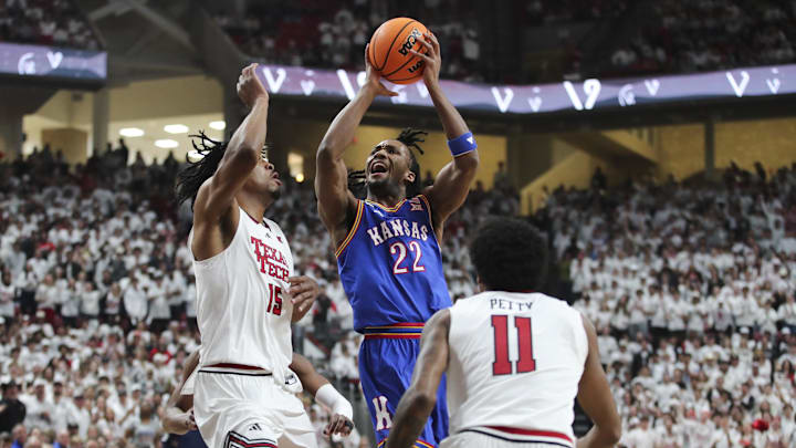 Feb 2, 2026; Lubbock, Texas, USA;  Kansas Jayhawks guard Darryn Peterson (22) goes to the basket against Texas Tech Red Raiders forward JT Toppin (15) in the first half at United Supermarkets Arena. Mandatory Credit: Michael C. Johnson-Imagn Images