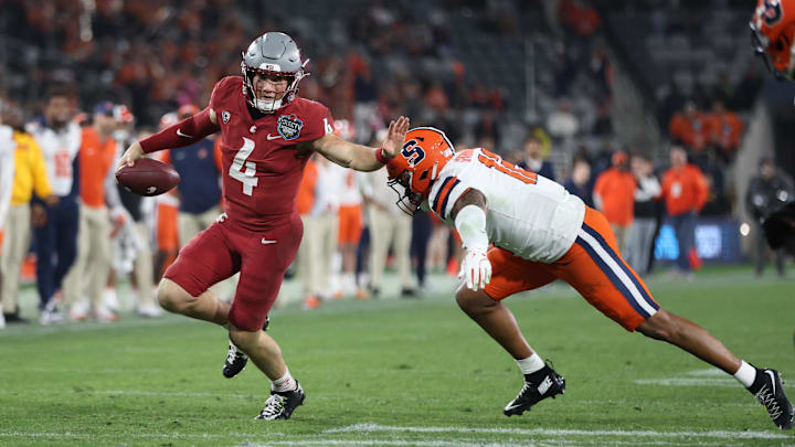 Dec 27, 2024; San Diego, CA, USA; Washington State Cougars quarterback Zevi Eckhaus (4) runs the ball against Syracuse Orange defense during the second half at Snapdragon Stadium. Mandatory Credit: Abe Arredondo-Imagn Images