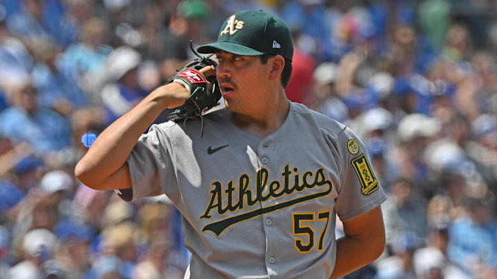Jun 14, 2025; Kansas City, Missouri, USA; Athletics starting pitcher Jacob Lopez (57) looks into home plate before throwing a pitch in the first inning against the Kansas City Royals at Kauffman Stadium. Mandatory Credit: Peter Aiken-Imagn Images Jun 14, 2025; Kansas City, Missouri, USA; Athletics starting pitcher Jacob Lopez (57) looks into home plate before throwing a pitch in the first inning against the Kansas City Royals at Kauffman Stadium. Mandatory Credit: Peter Aiken-Imagn Images
