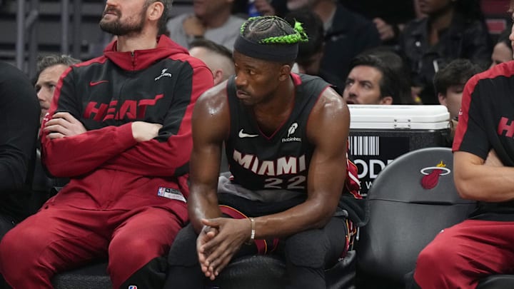 Jan 2, 2025; Miami, Florida, USA;  Miami Heat forward Jimmy Butler (22) looks on from the bench during the second half at Kaseya Center. Mandatory Credit: Jim Rassol-Imagn Images