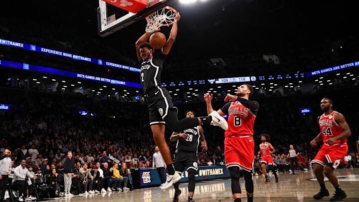 Nov 1, 2024; Brooklyn, New York, USA; Brooklyn Nets forward Cameron Johnson (2) dunks the ball in front of Chicago Bulls guard Zach LaVine (8) during the second half at Barclays Center. Mandatory Credit: Vincent Carchietta-Imagn Images