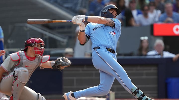 Sep 4, 2024; Toronto, Ontario, CAN; Toronto Blue Jays first baseman Spencer Horwitz (48) hits a single against the Philadelphia Phillies during the seventh inning at Rogers Centre.