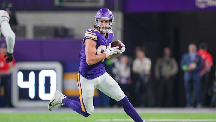 Nov 27, 2023; Minneapolis, Minnesota, USA; Minnesota Vikings tight end T.J. Hockenson (87) runs