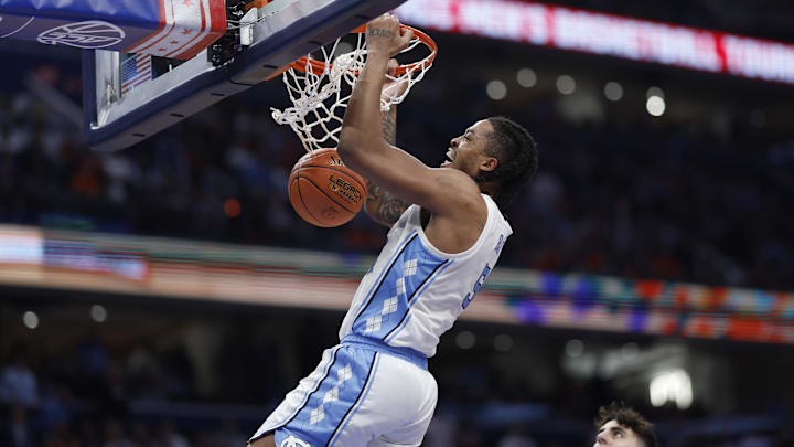 Mar 15, 2024; Washington, D.C., USA; North Carolina Tar Heels forward Armando Bacot (5) dunks the ball against Pitt in the ACC Tournament.