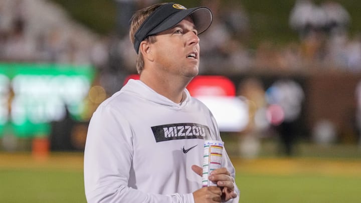 Sep 7, 2024; Columbia, Missouri, USA; Missouri Tigers head coach Eli Drinkwitz watches a replay against the Buffalo Bulls during the second half at Faurot Field at Memorial Stadium. Mandatory Credit: Denny Medley-Imagn Images Sep 7, 2024; Columbia, Missouri, USA; Missouri Tigers head coach Eli Drinkwitz watches a replay against the Buffalo Bulls during the second half at Faurot Field at Memorial Stadium. Mandatory Credit: Denny Medley-Imagn Images