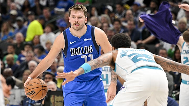 Nov 5, 2023; Dallas, Texas, USA; Dallas Mavericks guard Luka Doncic (77) looks to move the ball past