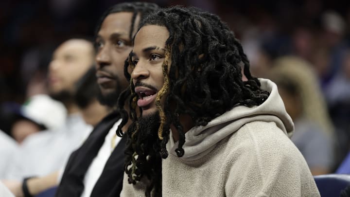 Mar 21, 2026; Charlotte, North Carolina, USA; Memphis Grizzlies guard Ja Morant watches from the bench during the second half against the Charlotte Hornets at Spectrum Center. Mandatory Credit: Brian Westerholt-Imagn Images