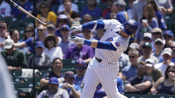 May 17, 2024; Chicago, Illinois, USA; Chicago Cubs outfielder Ian Happ (8) loses his bat.