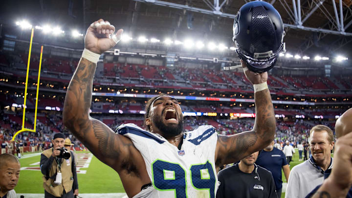 Dec 8, 2024; Glendale, Arizona, USA; Seattle Seahawks defensive end Leonard Williams (99) celebrates after defeating the Arizona Cardinals at State Farm Stadium. Dec 8, 2024; Glendale, Arizona, USA; Seattle Seahawks defensive end Leonard Williams (99) celebrates after defeating the Arizona Cardinals at State Farm Stadium.