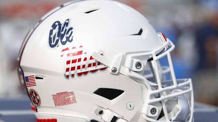 Sep 21, 2024; Oxford, Mississippi, USA; The Mississippi Rebels helmet with the American Flag Ole Miss Script logo on the sideline prior to the game against the Georgia Southern Eagles at Vaught-Hemingway Stadium. Mandatory Credit: Petre Thomas-Imagn Images