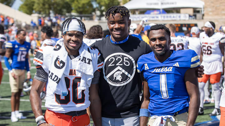 Sep 14, 2024; Tulsa, Oklahoma, USA; Oklahoma State Cowboys wide receiver Brennan Presley (80) and Tulsa Golden Hurricane wide receiver Braylin Presley (1) pose with their younger brother Braedon Presley after a game at Skelly Field at H.A. Chapman Stadium. Mandatory Credit: Brett Rojo-Imagn Images Sep 14, 2024; Tulsa, Oklahoma, USA; Oklahoma State Cowboys wide receiver Brennan Presley (80) and Tulsa Golden Hurricane wide receiver Braylin Presley (1) pose with their younger brother Braedon Presley after a game at Skelly Field at H.A. Chapman Stadium. Mandatory Credit: Brett Rojo-Imagn Images
