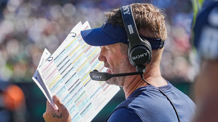 Dallas Cowboys head coach Brian Schottenheimer looks over his play sheet against the New York Jets at MetLife Stadium.