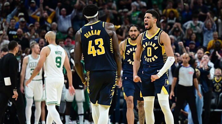 Oct 30, 2024; Indianapolis, Indiana, USA; Indiana Pacers guard Tyrese Haliburton (0) reacts to forward Pascal Siakam (43) making a three point shot to win the game against the Boston Celtics at Gainbridge Fieldhouse. Mandatory Credit: Marc Lebryk-Imagn Images