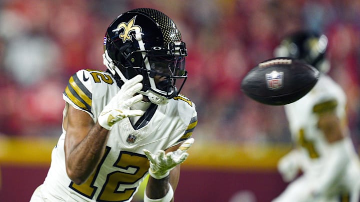 Oct 7, 2024; Kansas City, Missouri, USA; New Orleans Saints wide receiver Chris Olave (12) catches a pass during the second half against the Kansas City Chiefs at GEHA Field at Arrowhead Stadium. Mandatory Credit: Jay Biggerstaff-Imagn Images