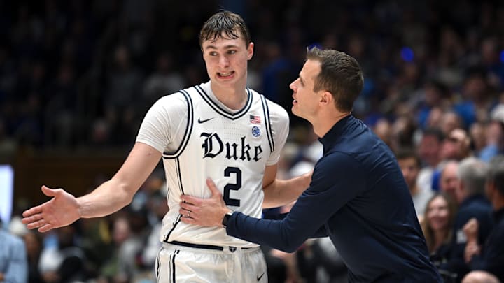 Duke basketball forward Cooper Flagg and head coach Jon Scheyer