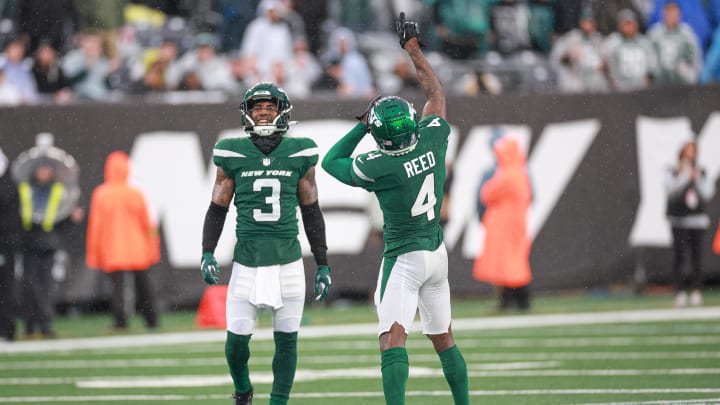 Dec 10, 2023; East Rutherford, New Jersey, USA; New York Jets cornerback D.J. Reed (4) and safety Jordan Whitehead (3) celebrate a defensive stop during the second half against the Houston Texans at MetLife Stadium. Dec 10, 2023; East Rutherford, New Jersey, USA; New York Jets cornerback D.J. Reed (4) and safety Jordan Whitehead (3) celebrate a defensive stop during the second half against the Houston Texans at MetLife Stadium.