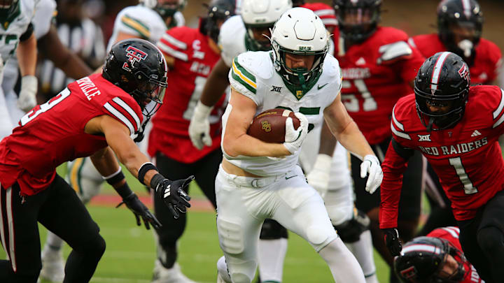 Oct 19, 2024; Lubbock, Texas, USA;  Baylor Bears running back Dawson Pendergrass (35) runs the ball against the Texas Tech Red Raiders in the second half at Jones AT&T Stadium and Cody Campbell Field. Mandatory Credit: Michael C. Johnson-Imagn Images