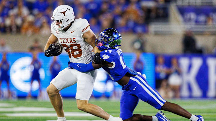 Texas Longhorns tight end Jack Endries (88) is tackled by Kentucky Wildcats defensive back Ty Bryant (14) during the second quarter at Kroger Field. 