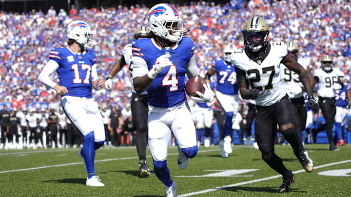 Buffalo Bills running back James Cook runs for a gain past New Orleans Saints cornerback Isaac Yiadom.