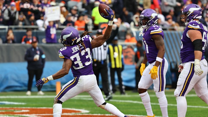 Nov 24, 2024; Chicago, Illinois, USA; Minnesota Vikings running back Aaron Jones (33) reacts after scoring a touchdown against the Chicago Bears during the second half at Soldier Field.