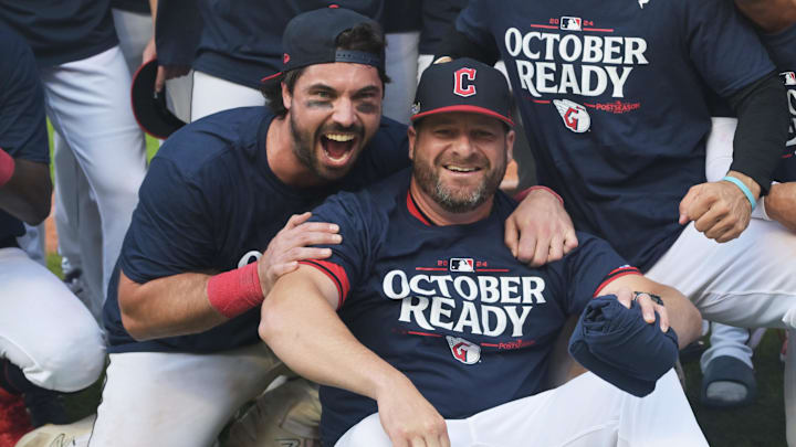 Cleveland Guardians manager Stephen Vogt (right) celebrates after beating the Minnesota Twins and clinching a playoff spot on Thursday at Progressive Field.