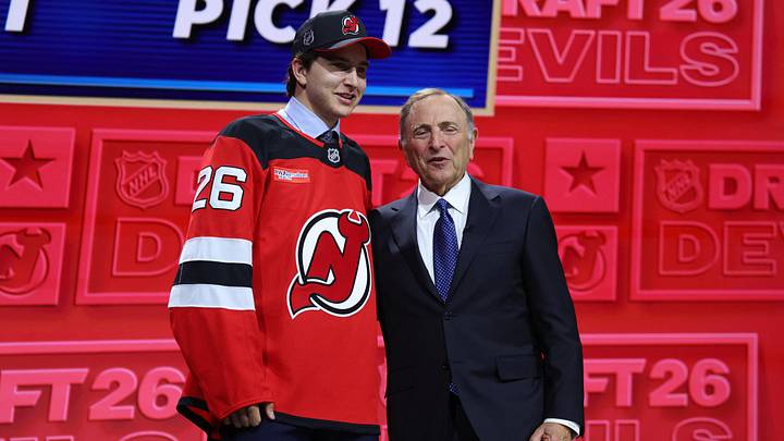 Alexander Command reacts beside NHL Commissioner Gary Bettman after being selected with the twelfth pick in the first round of the 2026 NHL Draft by the New Jersey Devils at KeyBank Center. Mandatory Credit: Timothy T. Ludwig-Imagn Images Alexander Command reacts beside NHL Commissioner Gary Bettman after being selected with the twelfth pick in the first round of the 2026 NHL Draft by the New Jersey Devils at KeyBank Center. Mandatory Credit: Timothy T. Ludwig-Imagn Images