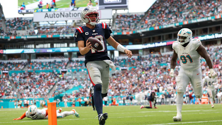 Sep 14, 2025; Miami Gardens, Florida, USA; New England Patriots quarterback Drake Maye (10) runs into the endzone for a touchdown against the Miami Dolphins in the third quarter at Hard Rock Stadium. Mandatory Credit: Nathan Ray Seebeck-Imagn Images