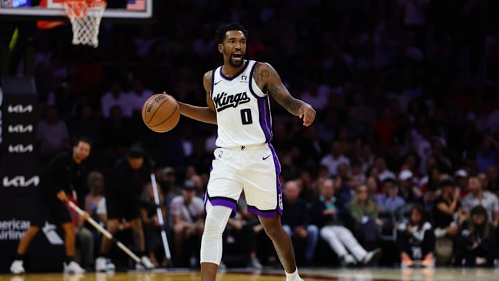 Nov 4, 2024; Miami, Florida, USA; Sacramento Kings guard Malik Monk (0) dribbles the basketball against the Miami Heat during the third quarter at Kaseya Center. Mandatory Credit: Sam Navarro-Imagn Images